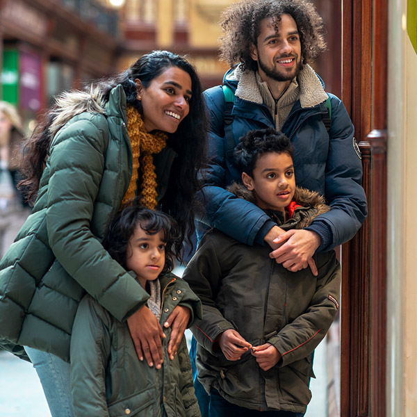 A family of four, walking around the city centre