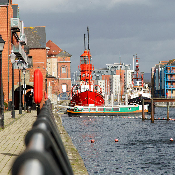 Shot of a harbour, looking out to boats on the water